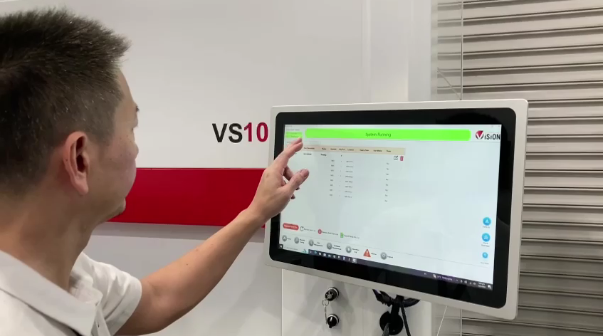 Warehouse staff operating the automated storage system console